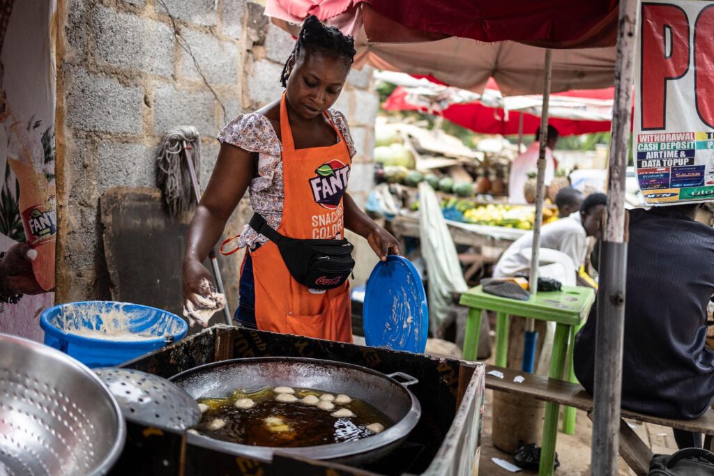woman frying buns